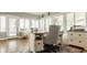 Bright office space with hardwood floors, a stylish desk, and multiple windows at 5872 Lake Kessler Ct, Indianapolis, IN 46226
