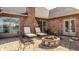 Private patio featuring a fire pit, chairs, and peaceful outdoor lounge areas at 5872 Lake Kessler Ct, Indianapolis, IN 46226
