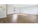 Spacious basement with wood-look floors and natural light from one window at 600 Alexandria Pike, Anderson, IN 46012