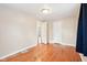 Bedroom featuring wood floors, neutral walls, two doors and natural light at 600 Alexandria Pike, Anderson, IN 46012