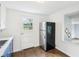Compact kitchen featuring stainless steel appliances and hardwood flooring at 600 Alexandria Pike, Anderson, IN 46012