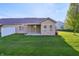 Expansive backyard view showcasing a covered patio and well-maintained landscaping at 6017 Riva Ridge Dr, Indianapolis, IN 46237