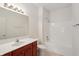 Well-lit bathroom with a modern vanity, toilet, and shower-tub combo at 6017 Riva Ridge Dr, Indianapolis, IN 46237