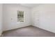 This bedroom features neutral colored walls, carpet flooring, and one window at 6017 Riva Ridge Dr, Indianapolis, IN 46237