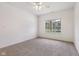 This bedroom features neutral colored walls, carpet flooring, and a window at 6017 Riva Ridge Dr, Indianapolis, IN 46237