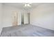 Spacious bedroom with multiple closets for ample storage and neutral paint at 6017 Riva Ridge Dr, Indianapolis, IN 46237