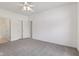 This bedroom features neutral colored walls, an overhead fan, and a closet at 6017 Riva Ridge Dr, Indianapolis, IN 46237