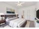 This bedroom features a comfortable bed, neutral walls, and an ensuite bathroom at 6017 Riva Ridge Dr, Indianapolis, IN 46237