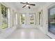Bright sunroom featuring natural light from multiple windows and an overhead ceiling fan at 6017 Riva Ridge Dr, Indianapolis, IN 46237
