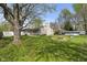 Spacious backyard featuring a fire pit and outdoor seating area at 615 W Stop 11 Rd, Indianapolis, IN 46217