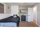 Bedroom with a large bed, wall shelves and a black dresser at 615 W Stop 11 Rd, Indianapolis, IN 46217