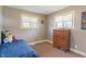 Cozy bedroom with natural light from two windows at 615 W Stop 11 Rd, Indianapolis, IN 46217