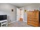 Neutral bedroom with carpet, and view of the wood floor in the doorway at 615 W Stop 11 Rd, Indianapolis, IN 46217