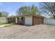 Well-maintained brick home with lush lawn and driveway; perfect for families at 615 W Stop 11 Rd, Indianapolis, IN 46217