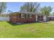 Beautiful brick home with well-kept lawn, showcasing curb appeal at 615 W Stop 11 Rd, Indianapolis, IN 46217