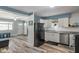 Open concept kitchen with stainless steel appliances, granite countertops and access to other living spaces at 615 W Stop 11 Rd, Indianapolis, IN 46217