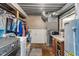 Practical laundry room and utility room with washer, dryer, water heater, and storage at 615 W Stop 11 Rd, Indianapolis, IN 46217