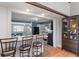 Open concept living area flowing into the kitchen, with a breakfast bar and ample space for entertaining at 615 W Stop 11 Rd, Indianapolis, IN 46217
