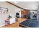 Spacious living room with hardwood floors and wood-burning fireplace at 615 W Stop 11 Rd, Indianapolis, IN 46217