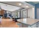 Spacious living area open to the kitchen, featuring abundant natural light, wood floors, and versatile spaces for Gathering at 615 W Stop 11 Rd, Indianapolis, IN 46217