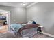 Relaxing bedroom with light neutral colors and an ensuite bathroom at 615 W Stop 11 Rd, Indianapolis, IN 46217