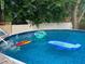 Inviting swimming pool with floats, perfect for summer relaxation and fun at 615 W Stop 11 Rd, Indianapolis, IN 46217