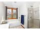 Inviting bathroom with a shower, bathtub, and window providing natural light at 6205 Albury Dr, Indianapolis, IN 46236