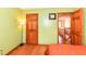 Bedroom with green walls featuring wood trim and a wooden door at 6205 Albury Dr, Indianapolis, IN 46236