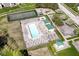Aerial view of a community pool, playground, and tennis court at 6205 Albury Dr, Indianapolis, IN 46236