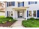 Charming home exterior with blue shutters and landscaped front yard at 6205 Albury Dr, Indianapolis, IN 46236