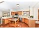 Spacious kitchen with oak cabinets, stainless steel appliances, and a tiled floor at 6205 Albury Dr, Indianapolis, IN 46236