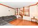 Open concept living space with hardwood floors, decorative columns, and a glimpse of the dining area at 6205 Albury Dr, Indianapolis, IN 46236