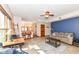 Open-concept living room with tile flooring, modern furnishings, and access to the kitchen at 6205 Albury Dr, Indianapolis, IN 46236