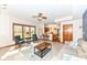 Bright and airy living room with large windows, tile floors, and open access to the kitchen at 6205 Albury Dr, Indianapolis, IN 46236