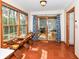 Bright sunroom featuring brick floors, large windows, and sliding glass doors to extend living space at 6205 Albury Dr, Indianapolis, IN 46236
