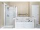 Clean bathroom with a separate shower and jacuzzi tub, perfect for relaxation at 6211 W Bayfront Shores, McCordsville, IN 46055