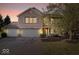 Charming brick home with three-car garage, blue shutters, and beautifully landscaped front yard at 6211 W Bayfront Shores, McCordsville, IN 46055