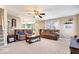Inviting living room with neutral tones, comfortable seating, and plenty of natural light from large windows at 6211 W Bayfront Shores, McCordsville, IN 46055