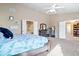 Inviting main bedroom featuring a large bed, dresser, and entrances to the bathroom and living space at 6211 W Bayfront Shores, McCordsville, IN 46055