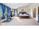 Spacious main bedroom with large bed, exercise bike, vaulted ceilings, and ample natural light at 6211 W Bayfront Shores, McCordsville, IN 46055