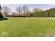 Spacious backyard with well-maintained lawn and perimeter landscaping at 6220 Yellow Birch Ct, Avon, IN 46123