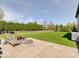 Backyard patio and spacious lawn with mature trees at 6220 Yellow Birch Ct, Avon, IN 46123