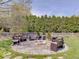 Backyard patio with fire pit and outdoor seating at 6220 Yellow Birch Ct, Avon, IN 46123