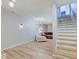 Basement living space with staircase, cozy seating area, and neutral color palette at 6220 Yellow Birch Ct, Avon, IN 46123