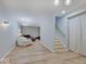 Finished basement featuring a living area, staircase, and modern lighting fixtures at 6220 Yellow Birch Ct, Avon, IN 46123