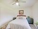 Bedroom featuring a ceiling fan, white walls, area rug, and bright natural light at 6220 Yellow Birch Ct, Avon, IN 46123