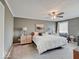 Spacious bedroom featuring a ceiling fan, neutral walls, carpet flooring, and bright natural light at 6220 Yellow Birch Ct, Avon, IN 46123