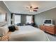 Bedroom featuring a ceiling fan, neutral walls, carpet flooring, with a tv and workspace at 6220 Yellow Birch Ct, Avon, IN 46123