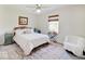 Bedroom featuring a ceiling fan, white walls, area rug, and bright natural light at 6220 Yellow Birch Ct, Avon, IN 46123