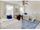 Charming bedroom featuring matching twin beds, cozy blue accents, area rug and bright windows at 6220 Yellow Birch Ct, Avon, IN 46123